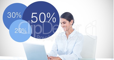 Businesswoman using laptop by data