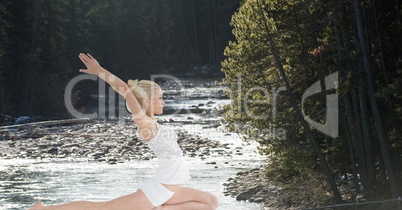 Double exposure of woman performing yoga in forest