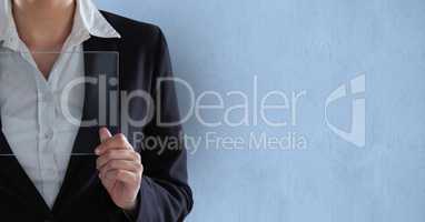 Midsection of businesswoman holding transparent digital tablet