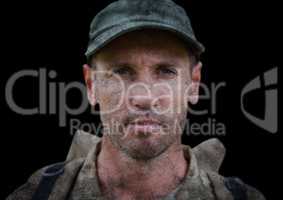 Soldier face against black background and grunge overlay