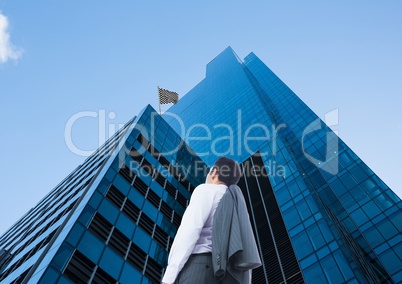 businessman looking up to see the checker flag in a building