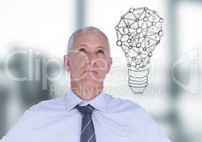 Business man thinking with lightbulb doodle against blurry grey office