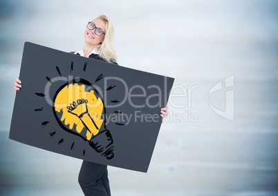 Business woman with giant blank card and lightbulb doodle against blurry blue wood panel