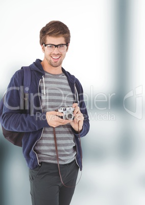 Young man holding camera