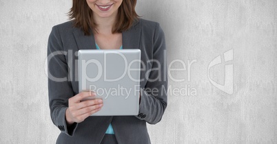 Midsection of businesswoman holding tablet PC