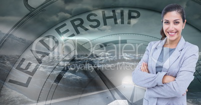 Smiling businesswoman with arms crossed against leadership clock