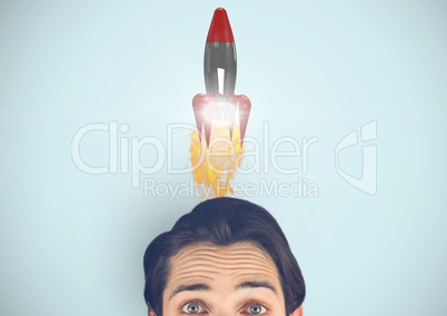 Portrait of man with rocket over head