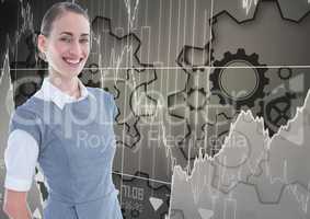 Smiling businesswoman against gears and graphs