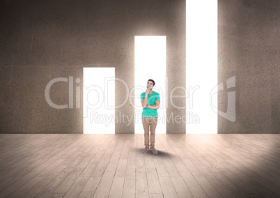 Thoughtful man standing against illuminated bar graph
