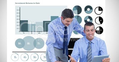 Businessmen using tablet PC against graph