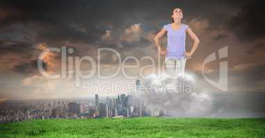 Businesswoman on cloud with buildings in background