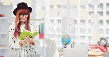 Female hipster reading book