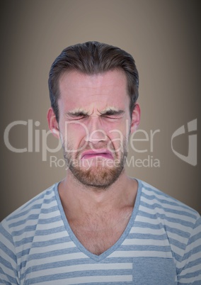 Man crying against brown background