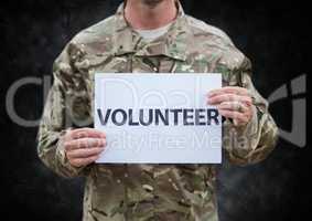 Soldier volunteer mid section against black grunge background