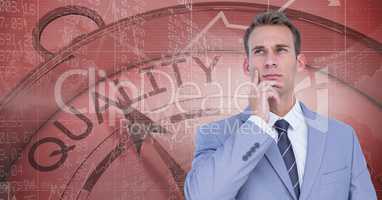 Thoughtful businessman standing against quality clock