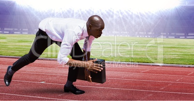 Digital composite image of businessman at starting point on racing track