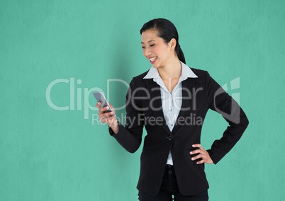 Happy businesswoman using mobile phone