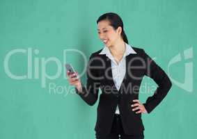 Happy businesswoman using mobile phone