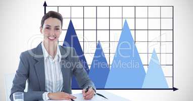 Businesswoman smiling with graph in background