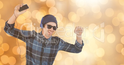 Happy man listening to music and dancing