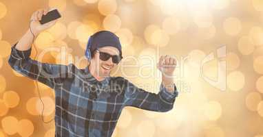 Happy man listening to music and dancing