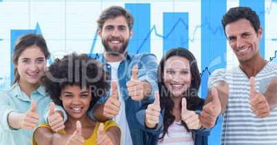 Casual business people showing thumbs up gestures against graphs