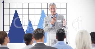 Businessman giving speech against graph
