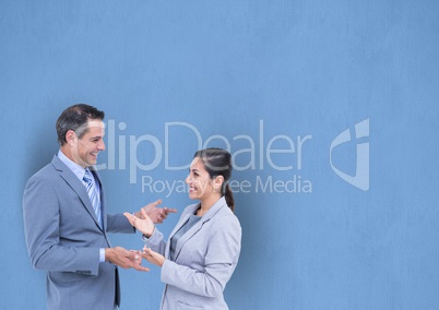 Happy business people talking against blue background