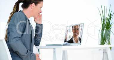 Businesswomen having video conference on laptop
