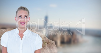 Smiling businesswoman looking up