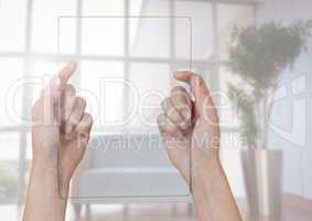 Hands holding glass screen against window