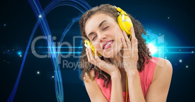 Young woman enjoying music on headphones