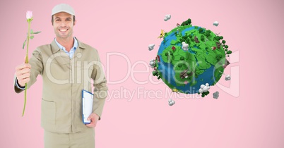 Smiling delivery man holding rose and clipboard against low poly globe