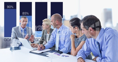 Businessman communicating with colleagues with graph in background