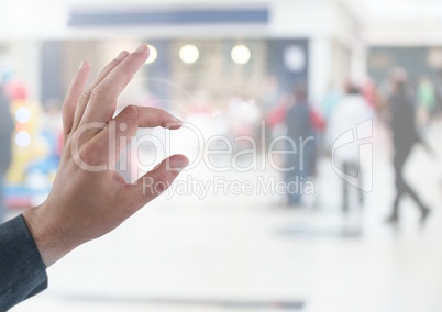 Hand touching air of shopping centre