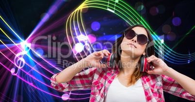 Female hipster with headphones against abstract background