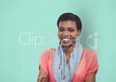 Portrait of happy female hipster standing against green background