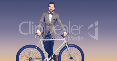 Portrait of hipster standing with bicycle