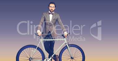 Portrait of hipster standing with bicycle