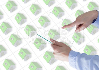 Hand touching a glass tablet with many houses