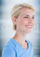 Close up portrait of woman smiling against blurry blue wood panel