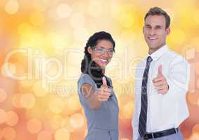 Portrait of confident business people showing thumbs up over bokeh