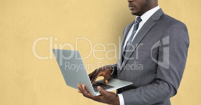 Midsection of businessman using laptop