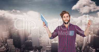 Hipster holding tablet PC against cityscape