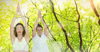 Double exposure of women with hands clasped exercising in forest