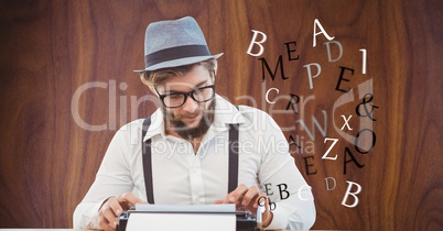 Hippie businessman using type writer against wall