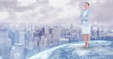 Businesswoman standing on globe against city