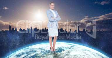 Businesswoman standing on globe against city