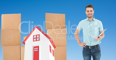 Delivery man by parcel and 3d house