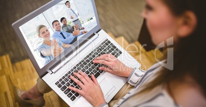 Woman video conferencing with colleagues on laptop